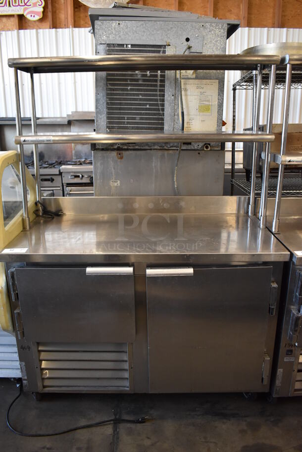2010 Leader LB48 FB Stainless Steel Commercial 2 Door Work Top Cooler w/ Double Over Shelf on Commercial Casters. 115 Volts, 1 Phase. 48x26x68.5. Tested and Working!