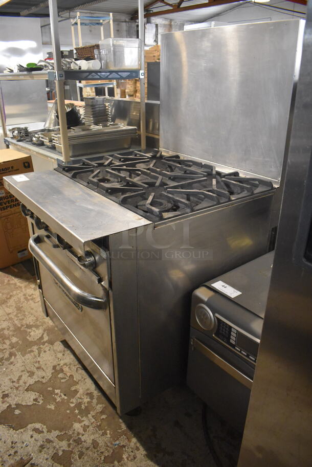 Southbend Commercial Stainless Steel Natural Gas Powered Oven With 4 Gas Burners and Stainless Steel Racks on Commercial Caster.  - Image 3 of 8