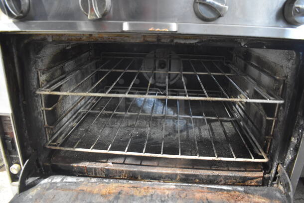 Southbend Commercial Stainless Steel Natural Gas Powered Oven With 4 Gas Burners and Stainless Steel Racks on Commercial Caster.  - Image 5 of 8