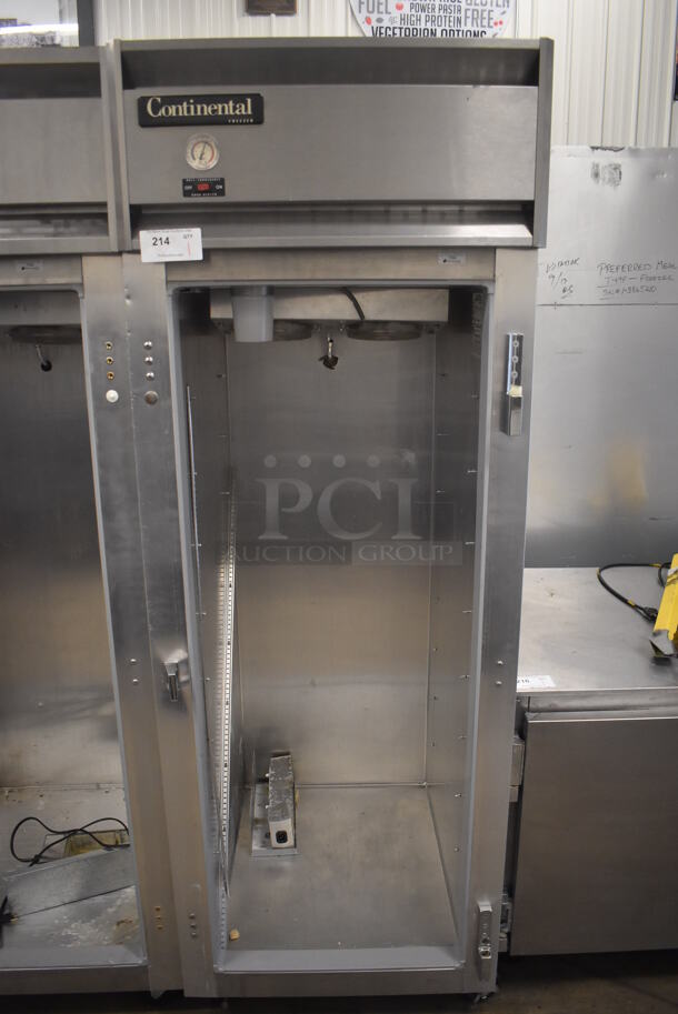 Continental 1FE Stainless Steel Commercial Single Door Reach In Freezer on Commercial Casters. Missing Door. 115 Volts, 1 Phase. 28.5x36x77.5. Tested and Powers On But Temps at 51 Degrees