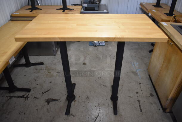 Wooden Bar Height Table on 2 Black Metal Straight Leg Table Bases. Stock Picture - Cosmetic  Condition May Vary.  48x24x43