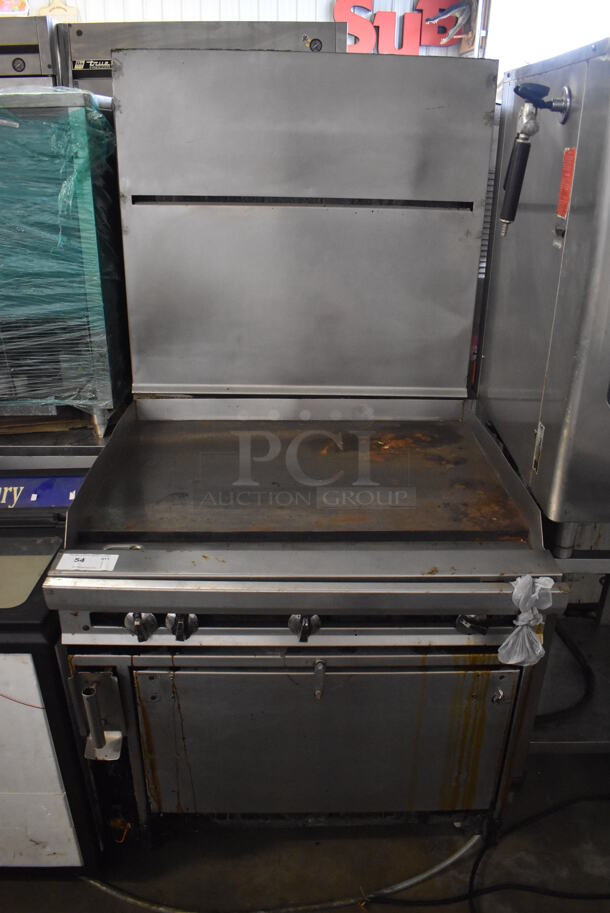 Stainless Steel Commercial Natural Gas Powered Flat Top Griddle w/ Convection Oven and Back Splash on Commercial Casters. 36x34x72.5
