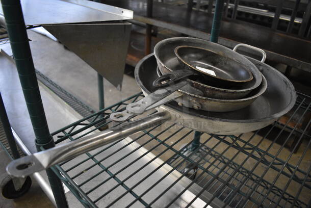 4 Various Metal Skillets. Includes 28x15.5x2. 4 Times Your Bid!