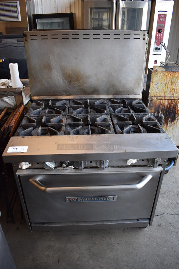 Baker's Pride Stainless Steel Commercial Natural Gas Powered 6 Burner Range w/ Oven and Back Splash on Commercial Casters. 36x33.5x56.5