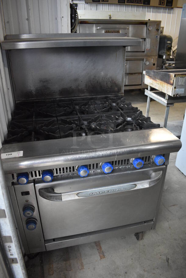 Imperial Stainless Steel Commercial Natural Gas Powered 6 Burner Range w/ Convection Oven, Back Splash and Over Shelf on Commercial Casters. 36x38x57