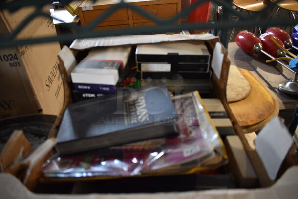 ALL ONE MONEY! Lot of 4 Tiers Worth of Various Items Including VHS Tapes, Bath Mat, Hymn Books and Small Collapsible Table. Does Not Come w/ The Shelving Unit - Image 4 of 8