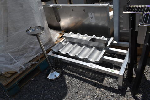 5 BRAND NEW SCRATCH AND DENT! Items; American Metalcraft OWBS Wine Bucket Stand for O2BWB Wine Bucket, American Range A99526 Grease Can, Chicago Metallic 45515 5 Loaf Glazed Uni-Lock Aluminum Baguette / French Bread Pan - 17 3/4" x 3 7/8" x 1" Compartments, Regency 36" x 20" x 8" Aluminum Dunnage Rack - 1630 lb. Capacity. 5 Times Your Bid!