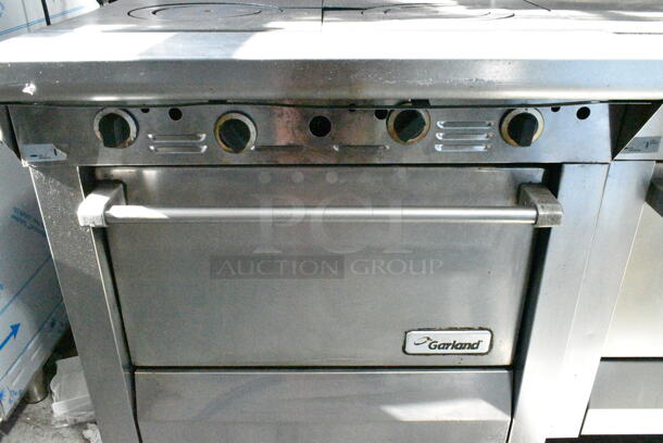 Garland M44T Stainless Steel Commercial Natural Gas Powered Flat Top w/ Oven, Salamander Cheese Melter and Back Splash on Commercial Casters. - Image 6 of 12