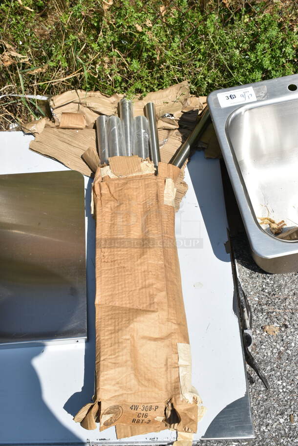 BRAND NEW SCRATCH AND DENT! Regency 600TS3036S 30" x 36" 16-Gauge 304 Stainless Steel Commercial Work Table with Undershelf - Image 4 of 5