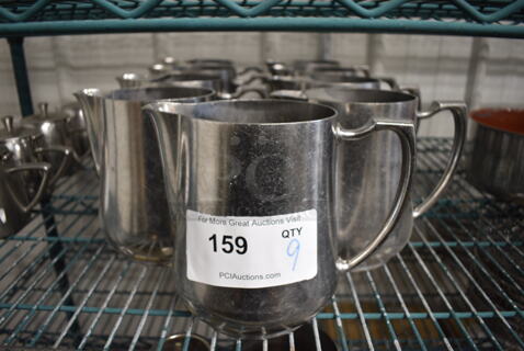 9 Metal Pitchers. 8x5x6.5. 9 Times Your Bid!