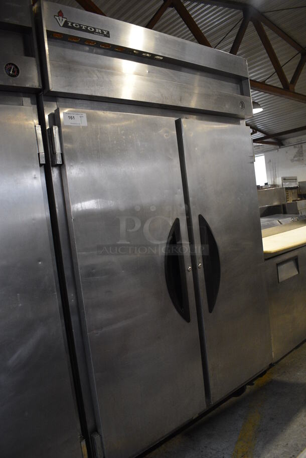 Victory Model VF-2 Stainless Steel Commercial 2 Door Reach In Freezer w/ Poly Coated Racks on Commercial Casters. 115 Volts, 1 Phase. 52x34x84. Tested and Working!