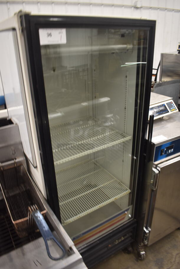 True GDM-12 Commercial Single Door White Reach-In Merchandiser Cooler With Polycoated Shelves On Commercial Casters. 115V, 1 Phase. Tested and Powers On But Does Not Get Cold - Image 2 of 5