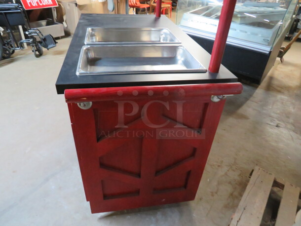 One Red Wood Work Station/Kiosk With A Black Laminate Top, 2 Full Size Hotel Pans, Push Bar,  4 Doors, And 2 Drawers, On Casters. 48X25X36 - Image 3 of 3