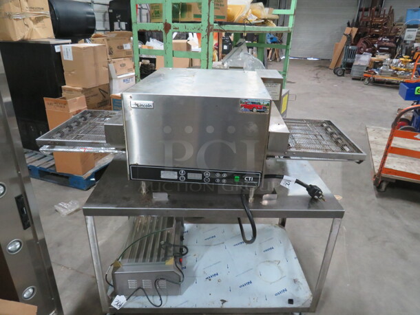 One CTI Lincoln Impinger Conveyor Pizza Oven On A Stainless Steel Table With SS Under Shelf On Casters. Model# 2502HB3U0701620. 240 Volt 1 Phase. Oven 50X32X18. Table 42X26X29. - Image 2 of 7