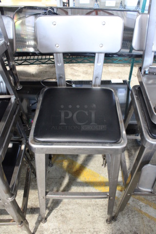 2 Gray Metal Industrial Style Bar Height Chairs w/ Black Seat Cushion. Stock Picture - Cosmetic Condition May Vary. 16x17x39. 2 Times Your Bid!