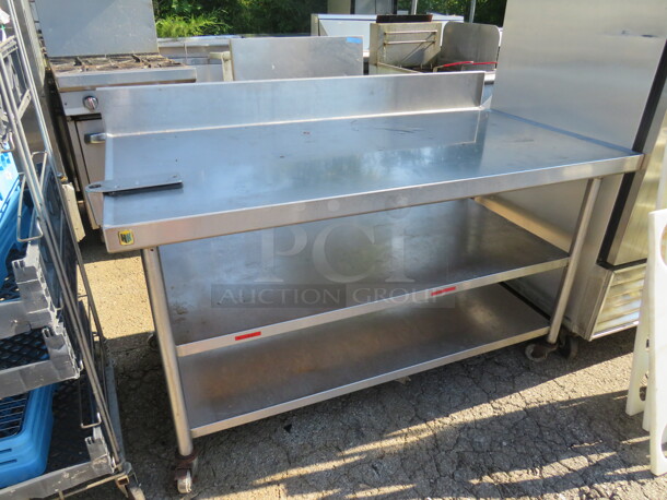 One Stainless Steel Table With 2 Stainless Steel Under Shelves, Back Splash, And A 10lb Can Opener, On Casters. 60X32X39 - Image 1 of 3