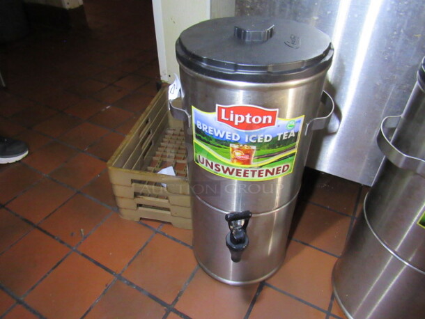 One Stainless Steel Tea Dispenser With Spigot And Lid.