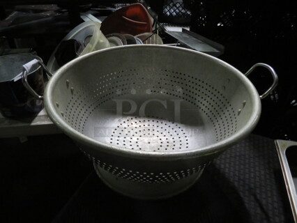 One 16 Inch Aluminum Colander.
