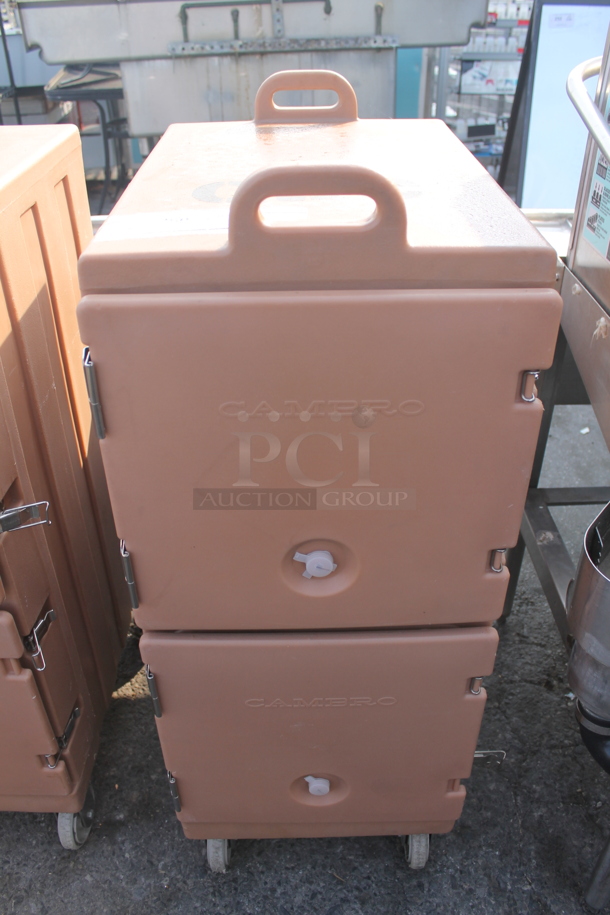 Cambro Insulated Pink Double Cavity Food Carrier With Pan Capacity On Commercial Casters. 