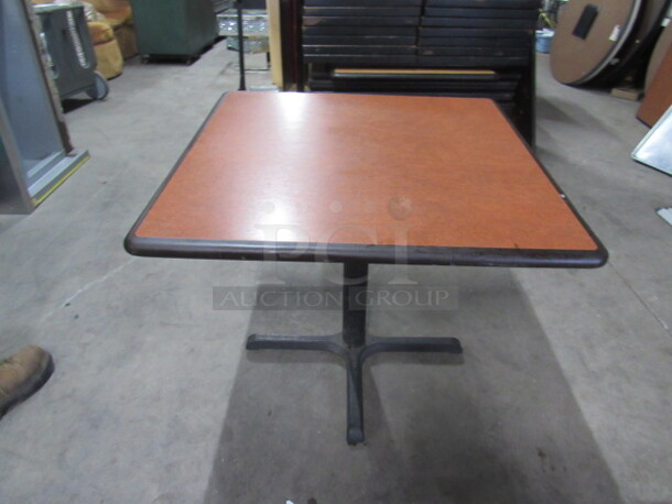One Brown Table Top On A Pedestal Base. 36X36X30