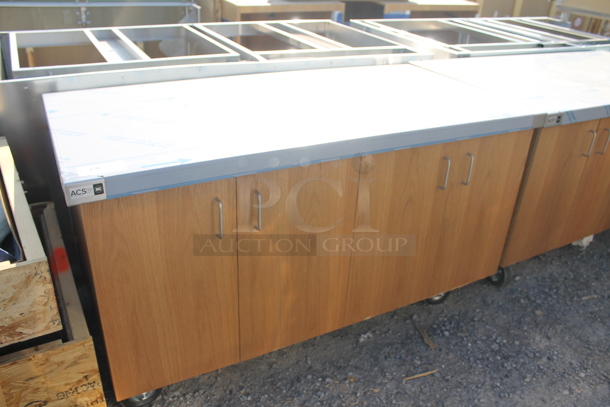 BRAND NEW! ACS FAB LLC Stainless Steel Counter w/ 4 Wood Pattern Doors on Commercial Casters. - Image 1 of 7