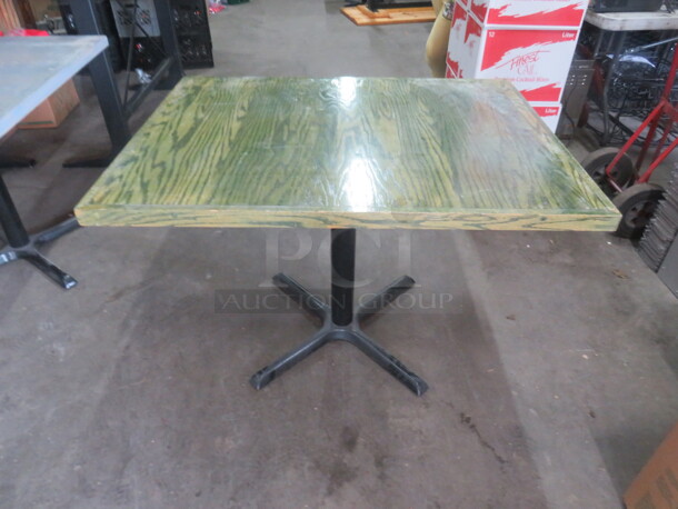 One Wooden Table Top In A Green Finish On A Pedestal Base. 42X32X29