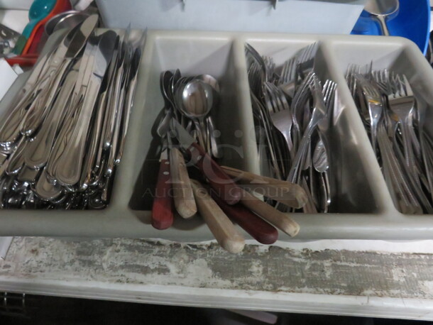 One Flatware Holder With Flatware.