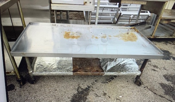 One Stainless Steel Equipment Table With Under Shelf On Casters. 60X30X21 - Image 1 of 1