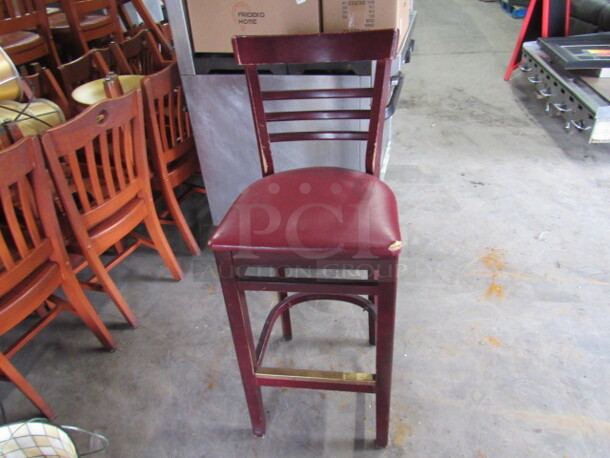 Wooden Bar Height Chair With A Cushioned Seat And Footrest. 2XBID
