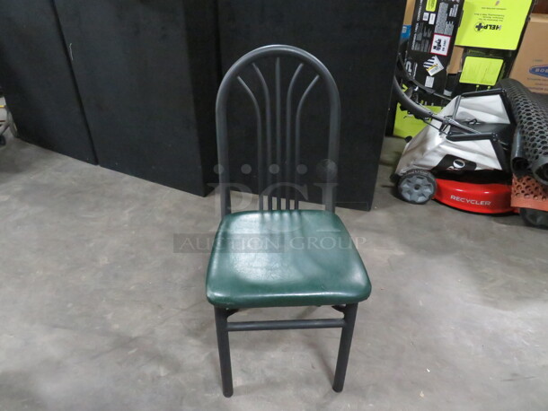 Black Metal Chair With A Green Cushioned Seat. 3XBID