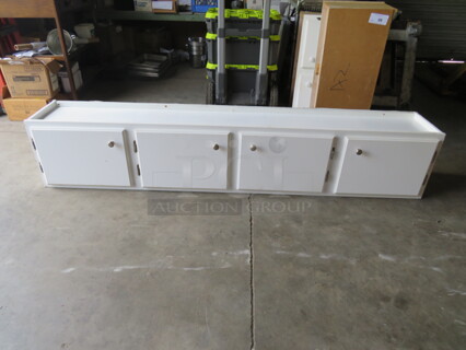 One 4 Door Cabinet. 80.5X13X18