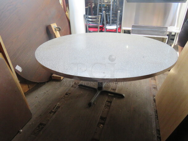 One Round Laminate Table Top On A Pedestal Base. 60X60X29