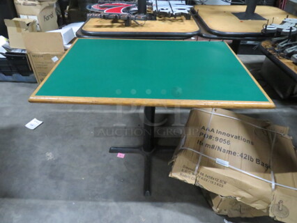 One Green Laminate Table Top On A Pedestal Base. 42X30X30