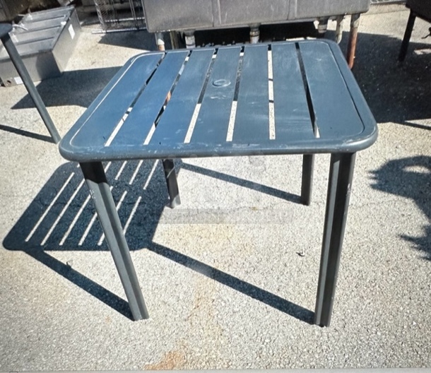 One Brown Aluminum Patio table. 32X32X29
