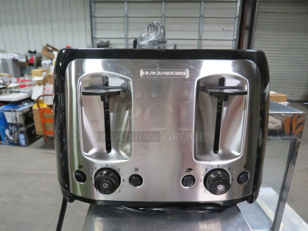 One NEW Black And Decker 4 Slice Toaster.