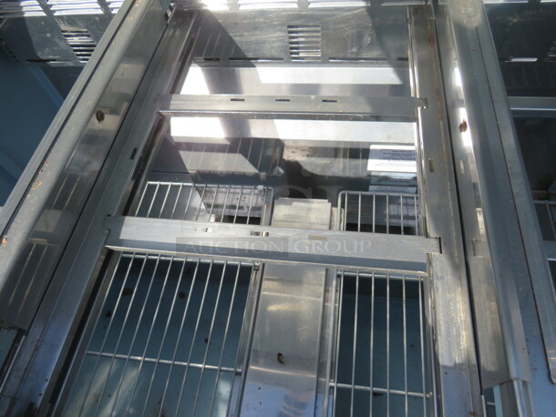 One Delfield 2 Door Refrigerated Prep Table With 2 Racks, And Cutting Board, On Casters. Model# 4448N-18M. 115 Volt. 48X40X46 - Image 3 of 3