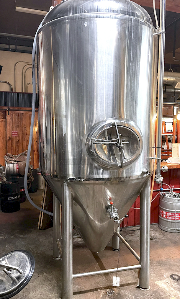 ? ?  BEAUTIFUL!! Stout Tanks & Kettles - 15 BBL Fermenter / Unitank (Jacketed). ? ?                 Features: Easily Converts to a Unitank or Brite Serving Tank;
Glycol Jacketed - 2 Zones: Cone and Sidewall; 
Shadowless Manway for Easy Cleaning;
Adjustable Racking Arm for Clear Transfer;
1.5" Sample Valve for Quality Testing;
Back Mounted Pressure Gauge;
Adjustable Feet for Leveling on Uneven Floors or Fine Height Adjustments;
Pressure Gauge Type:  Back Mount;
CIP Arm and 2.5" Rotating CIP Spray Ball;
2 Butterfly Valves;
Rated to 2-Bar (29 PSI);
1/2" NPT Welded Thermowell for Contactless Temperature Probe
Tank Thickness: 3mm
Jacket and Outer Shell Thickness: 2mm.
Cone: 60 degree Interior Angle.
51.5-in. diameter x 125-in.H. - Image 2 of 8