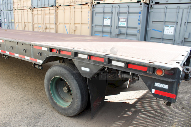 ROAD READY!! 40FT Steel Flatbed Tailer, 4 Wheels. 40FTx96".    VIN# 070F1283; Year 1970; Manufacturer Pike Trailer; Type Flatbed; Steel Construction; Length x Width 40' x 96"; Spring Ride Suspension; Location Single Fixed Axle; Tire Size LP 22.5; Wheel Construction Steel; Wheel Type Budd - Image 9 of 10