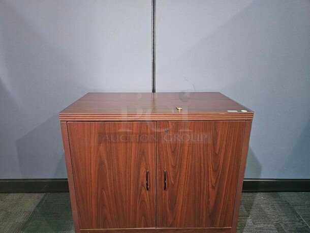Locking cabinet with shelf. Has set of keys- very nice piece! 36” W x 29.5” H x 20” D.  

  - Image 1 of 3