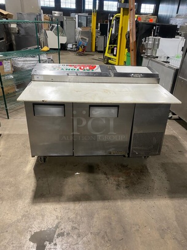 True Commercial Refrigerated Pizza Prep Table! With Commercial Cutting Board! With 2 Door Storage Space Underneath! Poly Coated Racks! All Stainless Steel! On Casters! Model: TPP60 SN: 13730805 115V 60HZ 1 Phase