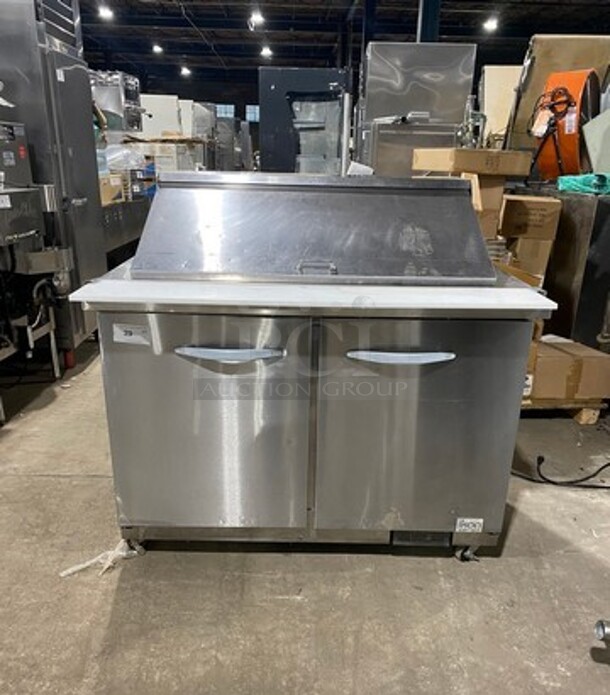 Kool It Commercial Refrigerated Sandwich Prep Table! With Commercial Cutting Board! With 2 Door Underneath Storage Space! All Stainless Steel! On Small Casters! Model: KSP48M SN: KSP48M7058040 115V 60HZ 1 Phase