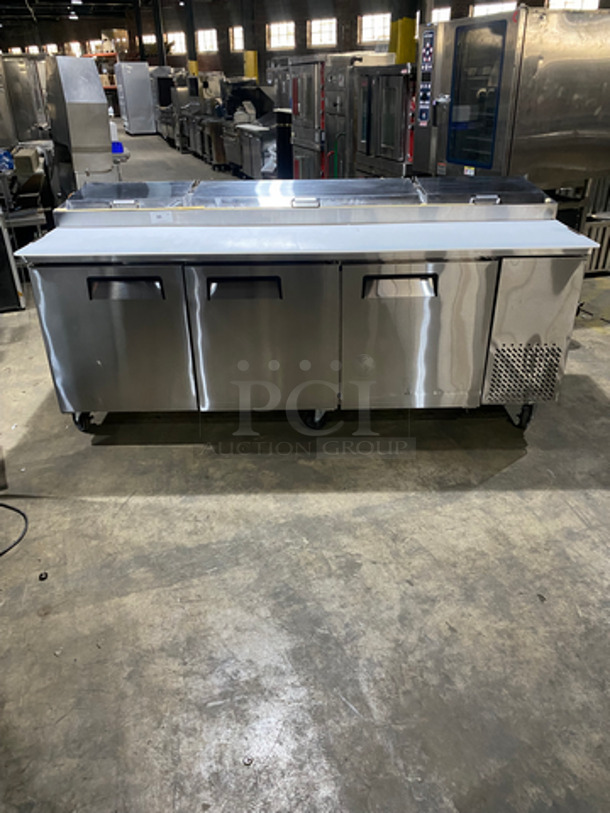 WoW! NEVER USED! All Stainless Steel Commercial Refrigerated Pizza Prep Table! With Commercial Cutting Board! With 3 Door Underneath Storage Space! With Poly Coated Racks! All Stainless Steel! On Casters! Model: LPP93 SN: LPP9312120584001 115V 60HZ 1 Phase