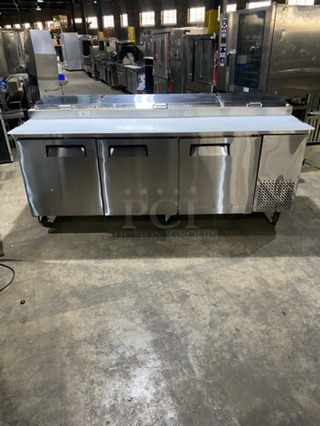 WoW! NEVER USED! All Stainless Steel Commercial Refrigerated Pizza Prep Table! With Commercial Cutting Board! With 3 Door Underneath Storage Space! With Poly Coated Racks! All Stainless Steel! On Casters! Model: LPP93 SN: LPP9312120584001 115V 60HZ 1 Phase