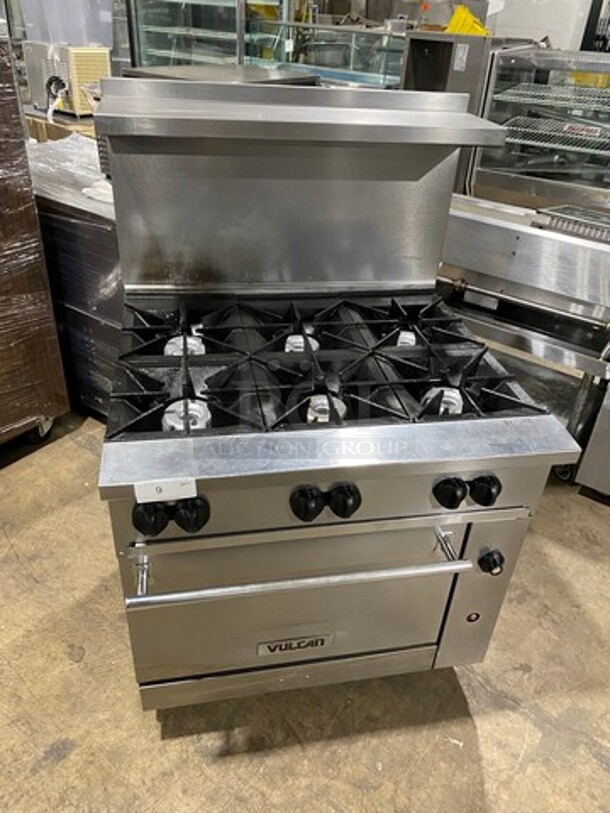 Vulcan Commercial Natural Gas Powered 6 Burner Stove! With Raised Back Splash And Salamander Shelf! With Oven Underneath! All Stainless Steel! Model: 36S6BN SN: 481938247 - Image 1 of 9