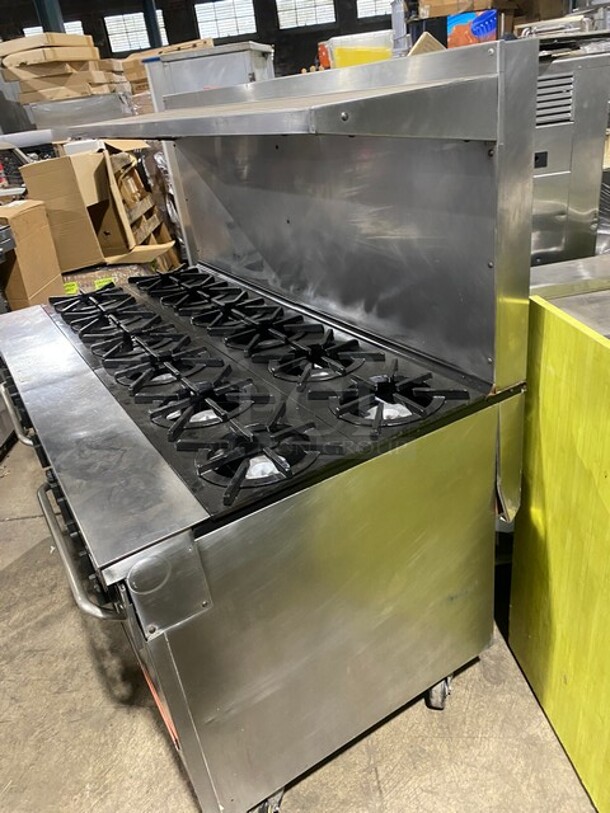 Southbend Commercial Natural Gas Powered 12 Burner Stove! With Raised Back Splash And Salamander Shelf! With 2 Full Size Oven Underneath! All Stainless Steel! On Casters! Working When Removed! - Image 2 of 10