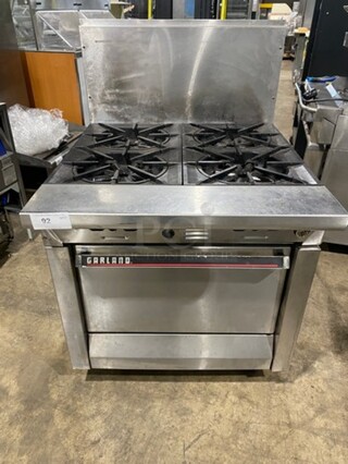 Garland Commercial Natural Gas Powered 4 Burner Stove! With Oven Underneath! With Raised Backsplash! All Stainless Steel! Model M44R Serial 130600101753! On Legs!