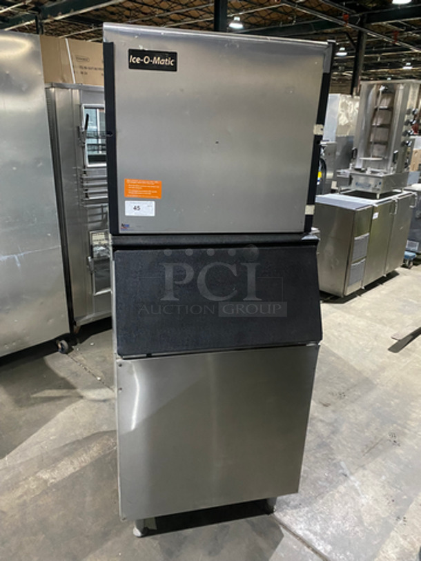 Ice-O-Matic Commercial Ice Making Machine Head! All Stainless Steel Body! On Commercial Ice Bin! On Legs! 2x Your Bid Makes One Unit! Model: ICE1006HW4 SN: 14101280011399 208/230V 60HZ 1 Phase, Model: B55PPA SN: S60005111Z