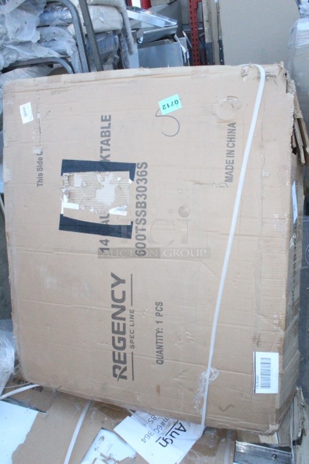 BRAND NEW SCRATCH & DENT! Regency Spec Line 30" x 36" 14 Gauge Stainless Steel Commercial Work Table with 4" Backsplash and Undershelf. In the original packaging. 

 - Image 2 of 3