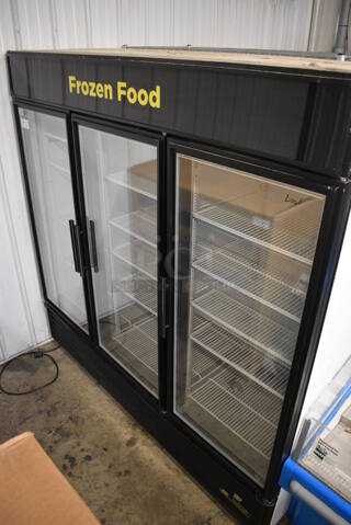 2013 True GDM-72F-LD Metal Commercial 3 Door Reach In Freezer Merchandiser w/ Poly Coated Racks. 115/208-230 Volts, 1 Phase. 78x32x79