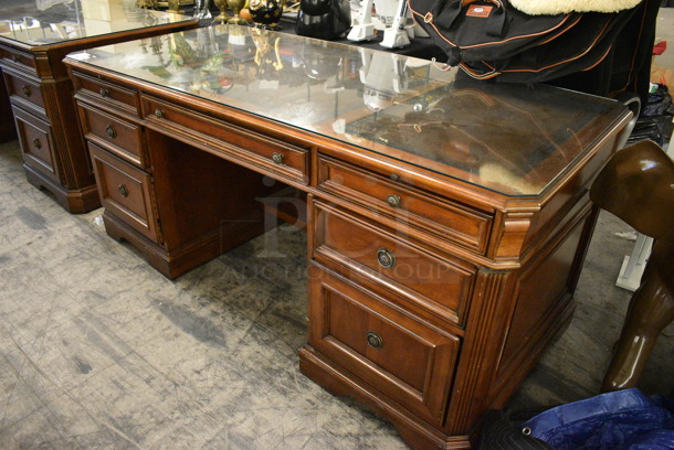 Hooker Wooden Desk w/ 7 Drawers and Glass Top Pane.